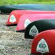 Row of canoes/kayaks on a gravelly shore — demonstrates on-site boat/river activity and equipment consistent with Saco River access noted on the website.
