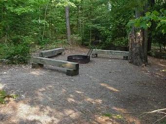 A South Manitou Group campsite with fire ring