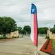 A red white and blue flag with a blue star on it
