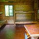 Frosty Bay Cabin, wooden interior of cabin with four bunks and a table