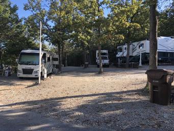 Level gravel RV site with full hook-ups at Branson Shenanigans RV Park