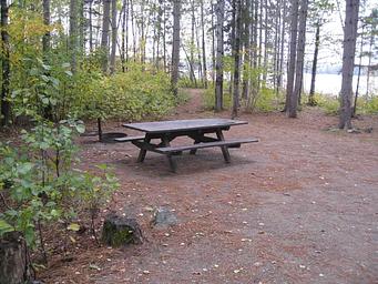 Picture of picnic table and fire ring.
