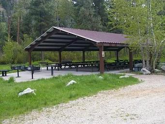 This is one of two large-group pavillions that can accommodate up to 100 people with picnic tables and cement site pads.