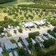 High-angle view down the main park road with RV sites on both sides, useful for showing overall scale and site arrangement (site social image / homepage).