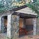 Picnic shelter with stone pillars.