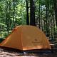 An orange tent pitched at Congaree National Park