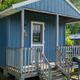 Exterior photo of a cabin on property — directly relevant to lodging options (page context: cabins/glamping).
