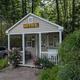 Small on-site office building with ‘OFFICE’ sign, porch and surrounding trees — useful as the campground check-in/facility view (source: Photos page of Highland Campgrounds).