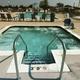 Hot tub/jacuzzi view looking toward the pool and grounds — highlights additional water amenity on the property.