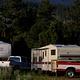 Trucks and trailers in a group campsite.