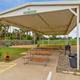 Covered picnic/sports pavilion with picnic tables and grill — shows on-site outdoor gathering amenities; image appears on the resort’s listing page.