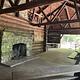 A photo of facility CAVE MOUNTAIN LAKE GROUP PICNIC SHELTER with Picnic Table, Fire Pit, Shade