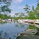 Waterfront view with docks and moored boats — depicts the campground's marina and lake access as shown on the property's homepage gallery.