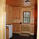 Kitchen of Peterson Cabin with Stove and refrigerator