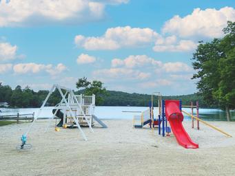 Beach playground and swim area on the lake — clear photo of on-property waterfront recreational facilities (homepage slideshow at https://www.tippicanoe.com/).
