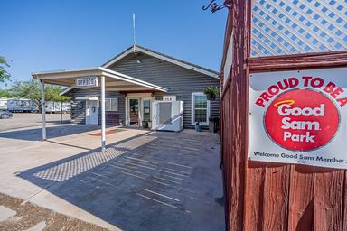 Clear exterior shot of the office area with a Good Sam Park sign visible and RVs at the site — useful facility photo from the site gallery. 