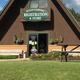 Clear photo of the park’s registration & store building (sign reads ‘Registration & Store’). Source page 'Rates' on the property site shows this on-site facility, making it useful for the property gallery.