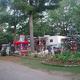RV/trailer campsite with site decorations and landscaping — illustrates the appearance of campsites and lot layout; appears on the site's About Us page.