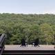 Deck view with Adirondack chairs looking out over the valley and treeline — good for illustrating guest views and the property's scenic outlook (from the property's gallery).