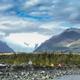 Campsite scene with tents, vehicles and glacier in background — illustrates tent camping and views from the campground (source photos page and filename indicate camp area).
