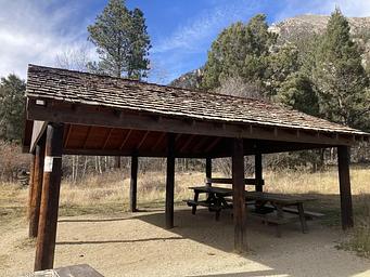 Wooden pavilion with picnic tables