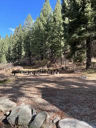 Open dirt space in front of picnic area