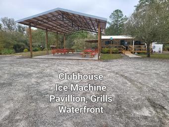 Clubhouse pavilion and facility area (covered picnic/grill structure) labeled on the park site — useful for showing guest amenities and communal space.