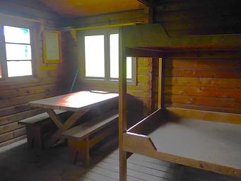Sergief Island Cabin interior showing wood bunkbed and table