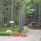 Photo from the site's Photo Gallery showing the 'Cliff side' campsite loop with tents and wooded paths — good depiction of campsite setting and facilities.