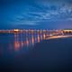 Long-exposure dusk view of a pier over the water (Gulf State Park pier image used as a background on the park page) — attractive scenic shot of a notable on-site landmark.