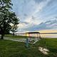 A photo of facility JUNIPER POINT with Picnic Table, Electricity Hookup, Shade, Waterfront, Water Hookup