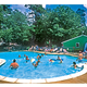 On the homepage: clear photo of the campground swimming pool with campers and poolside building — useful facility shot showing on-site recreation.
