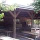 Covered picnic pavilion with multiple picnic tables — useful image of communal facilities available at the campground (visible on the resort's page).