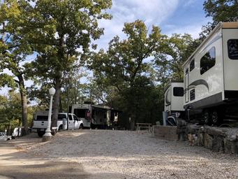 Level gravel RV site with full hook-ups at Branson Shenanigans RV Park