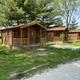 Log cabin exterior with front porch