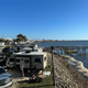 A Group of Cars Parked Next to a Body of Water