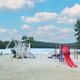 Beach playground and swim area on the lake — clear photo of on-property waterfront recreational facilities (homepage slideshow at https://www.tippicanoe.com/).
