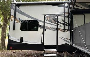 42’ Luxury Toyhauler with rare Side Patio
