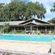 Swimming pool and clubhouse at Lake Rousseau RV Resort