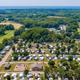 Aerial overview of the campground showing layout of lots, roads, central buildings and surrounding landscape — good overall property view for a gallery (homepage slider image).