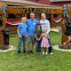 The Rasmussen family under the hand-carved welcome arch outside the campground office