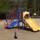 Playground equipment on sandy surface — documents on-site play area for children (gallery page).