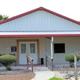 Exterior view of the clubhouse building — highlights an on-site facility/amenity for guests (from amenities page).