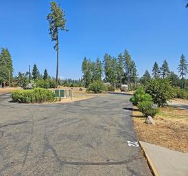 Road intersection inside the park with marked site numbers and RVs — helpful for illustrating site signage, circulation and scale of the campground (appears on site gallery).