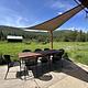 Star Meadow Guard Station back patio with tables and chairs and bbq