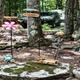 Small landscaped campsite area with decorative items and parked vehicles visible — illustrates the campground’s campsite environment. Source: Rules page image on the campground website.