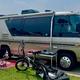On-site RV campsite shot showing an RV parked on a concrete pad with site furnishings and nearby sites visible — illustrates typical RV accommodations at the park (from site image set).