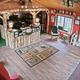 Interior of the campground office/store: shows the rustic reception desk, seating and retail area — matches site’s homepage imagery for welcome/office.