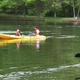 Kayaking on a lake at the property — demonstrates on-site water recreation available to guests (page context: slideshow kayaking / slideshowkymers_kayaking.jpg).
