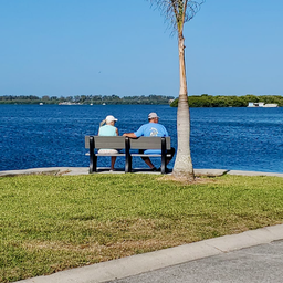 Waterfront view with bench and bay visible — demonstrates the park’s bayfront scenery and setting (gallery image ‘bench-on-canal’ on the property site).